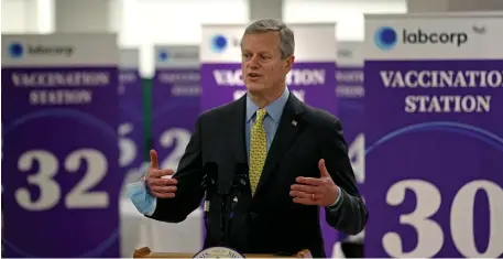  ?? MATT sTonE / hErAld sTAff ?? BY THE NUMBERS: Gov. Charlie Baker speaks during a tour Wednesday of the mass vaccinatio­n site at the Natick Mall.