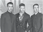  ?? JEAN- BAPTISTE LACROIX/ AFP VIA GETTY IMAGES ?? The Jonas Brothers, from left, Joe, Nick and Kevin, took a tour break.