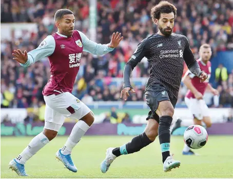  ?? Reuters ?? Liverpool’s Mohamed Salah misses a chance as Burnley’s Nick Pope attempts to save during a recent match in England.