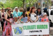  ?? MARIAN DENNIS — DIGITAL FIRST MEDIA ?? Hundreds rallied Saturday along High Street in Pottstown to make their voices heard concerning climate change and the need for better policies. The march was one of hundreds that were taking place around the country to spur change and bring awareness...