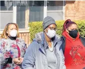  ?? MIKE NOLAN/DAILY SOUTHTOWN ?? Lakeisha Williams, center, and her three children escaped unharmed after at least 30 shots were fired at their Hazel Crest home.