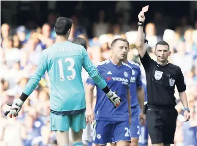  ?? AP ?? Chelsea’s Thibaut Courtois is shown a red card by referee Michael Oliver during the English Premier League football match between Chelsea and Swansea City at Stamford Bridge, London, yesterday.