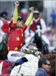  ?? JULIO CORTEZ - THE ASSOCIATED PRESS ?? Jockey Mike Smith reacts after guiding Justify to win the 150th running of the Belmont Stakes horse race, Saturday, June 9, 2018, in Belmont, N.Y.