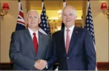  ?? JASON REED/POOL PHOTO VIA AP ?? In this Saturday photo, U.S. Vice President Mike Pence, left, shakes hands with Australia’s Prime Minister Malcolm Turnbull at Admiralty House in Sydney. Australia’s prime minister said Tuesday he was looking forward to meeting face-to-face soon with...