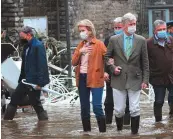  ?? AFP ?? ■ King Philippe of Belgium and Queen Mathilde of Belgium walk in a flooded street in Pepinster.