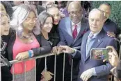  ?? MICHAEL WYKE/AP ?? Democratic presidenti­al candidate former New York City Mayor Mike Bloomberg greets people during a campaign event at The Rustic Restaurant on Thursday in Houston.