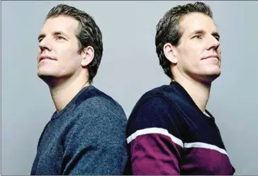  ?? VINCENT TULLO/THE NEW YORK TIMES ?? Tyler (left) and Cameron Winklevoss, the longtime bitcoin investors famed for their legal battles with Mark Zuckerberg over Facebook, in New York, on December 12.