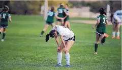  ?? ADOLPHE PIERRE-LOUIS/JOURNAL ?? St. Pius’ Gabi Jeantete reacts as Hope Christian players celebrate their victory over the Sartans in the Class 4A semifinals Thursday.