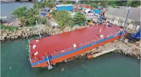  ??  ?? Barge built by Walkers Colombo Shipyard to carry out the sea piling work