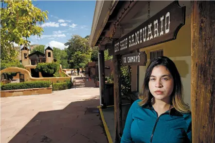  ?? LUIS SÁNCHEZ SATURNO/THE NEW MEXICAN ?? Janeth Antillon of Chimayó poses for a portrait outside the gift shop at the Santuario de Chimayó on Thursday. Antillon is a DACA recipient who was brought from Mexico to Arizona at age 7.