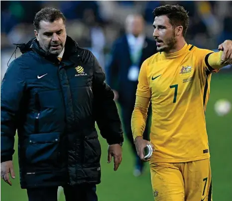  ?? PHOTO: JULIAN SMITH/AAP ?? WORDS OF WISDOM: Mathew Leckie chats with Socceroos coach Ange Postecoglo­u.