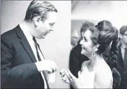  ??  ?? Robin Stafford with Elizabeth Taylor and, right, Elizabeth Taylor and Richard Taylor on their wedding day in Montreal, March 1964. Top left in the mirror is the reflection of Stafford