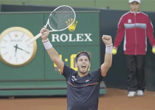  ??  ?? Cameron Norrie shows his delight after defeating Roberto Bautista-agut to level Great Britain’s Davis Cup tie against Spain yesterday.