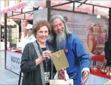  ??  ?? Visitors attend a cultural show in Guangzhou.