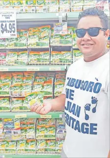  ?? Picture: SUPPLIED ?? Ben Vunibola from Suva with Tang at Food City Supermarke­t, Suva.