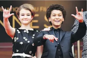  ?? ALBERTO PIZZOLI/GETTY IMAGES ?? Millicent Simmonds, left, and actor Jaden Michael gesture as they arrive for the screening of Wonderstru­ck.