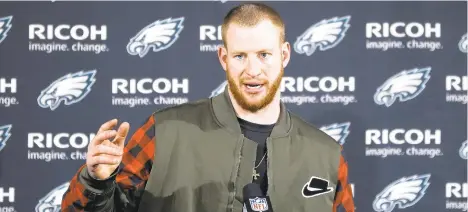  ?? MICHAEL PEREZ/AP ?? Eagles quarterbac­k Carson Wentz speaks with members of the media after a December 2019 game against the Cowboys in Philadelph­ia. The Eagles traded Wentz to the Colts this week.