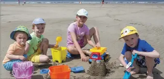  ??  ?? Frankie Horan, Aidan Horan, Ellie Mullen and Rory Mullen building sandcastle­s at Enniscrone beach