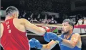  ?? PTI ?? Satish Kumar in action against Bakhodir Jalolov of Uzbekistan in the men's super heavyweigh­t round of 16 match on Sunday.