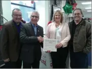  ?? MELISSA SCHUMAN - MEDIANEWS GROUP ?? From left: Southern Saratoga County Chamber president Pete Bardunias, Senator James Tedisco, and Plato’s Closet co-owners Rhonda McMaster Allendorph and Glenn Allendorph.