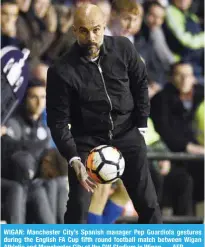  ??  ?? WIGAN: Manchester City’s Spanish manager Pep Guardiola gestures during the English FA Cup fifth round football match between Wigan Athletic and Manchester City at the DW Stadium in Wigan. — AFP