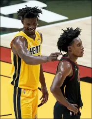  ?? WILFREDO LEE — THE ASSOCIATED PRESS ?? Heat forward Jimmy Butler, rear, plays with Collin Sexton’s hair during the second half March 16 in Miami.