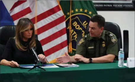  ?? CAROLYN KASTER — THE ASSOCIATED PRESS ?? First lady Melania Trump talks with Rodolfo Karisch, chief patrol agent, as she visits a U.S. Customs border and protection facility in Tucson, Ariz., last week. She wanted to find out more about how her husband’s strict immigratio­n policy was playing...