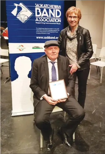  ?? Photo contribute­d ?? Greg McLean received the SBA 2018 Distinguis­hed Band Director Award in Regina, Dec. 4. Standing with him is his wife, Marcia, who is the artistic director of the Swift Current Oratorio Choir and the Prairie Spirit chamber choir.