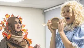  ??  ?? Here Goldilocks, played by Rev Wendy Dalrymple and the Magic Tree, played by Nurain Nur, discuss the merits of the Three Bears’porridge. Picture by Kevin Ryan of Charnwood Arts