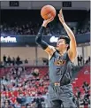  ?? [BRAD TOLLEFSON/THE ASSOCIATED PRESS] ?? Oklahoma State's Lindy Waters III shoots during the first half of the Cowboys game against Texas Tech Wednesday night in Lubbock, Texas. The Red Raiders won 84-80.