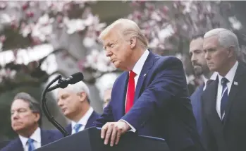  ?? ANDREW HARRER/BLOOMBERG ?? U.S. President Donald Trump listens to a question at the White House’s Rose Garden on Friday after declaring a national emergency over the coronaviru­s outbreak to allow for more federal aid for states and municipali­ties.