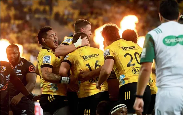  ?? GETTY IMAGES ?? Hurricanes players celebrate Danes Coles’ try during the impressive win over the Sharks. ‘‘I can’t fault the effort,’’ said coach Jason Holland.