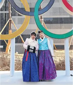  ?? Picture: Getty Images. ?? Women wearing traditiona­l Korean clothing pose with the Olympic Rings ahead of the PyeongChan­g 2018 Winter Games.