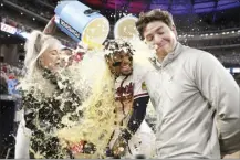  ?? Atlanta Journal-Constituti­on via AP photo ?? The Braves’ Ronald Acuña Jr. reacts as he gets doused during an interview after Atlanta’s 6-5 win over the Chicago Cubs on Wednesday.