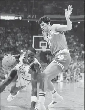  ?? AP File ?? North Carolina forward Michael Jordan tries to drive past Indiana forward Mike Giomi at Omni Coliseum in Atlanta, Ga, on March 23, 1984.
