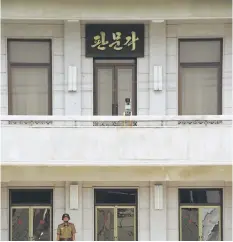  ??  ?? A North Korean soldier stands guard on the north side at the truce village of Panmunjom in the Demilitari­zed Zone dividing the two Koreas on July 19. North Korea’s economy grew at its fastest pace in 17 years in 2016, South Korea’s central bank said...