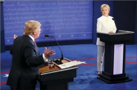  ?? ASSOCIATED PRESS ?? Democratic presidenti­al nominee Hillary Clinton and Republican presidenti­al nominee Donald Trump face off during the third presidenti­al debate at UNLV in Las Vegas on Wednesday.