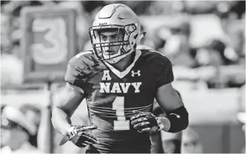  ?? DAVID ROSENBLUM, AP ?? Safety Alohi Gilman has been a key contributo­r to Navy’s defense as a freshman. “I just came in here with the mind-set that I wanted to play and contribute right away,” he says.