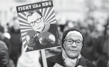  ?? Getty Images ?? A protester holds a Justice Ruth Bader Ginsberg sign during the Woman’s March in New York in January.