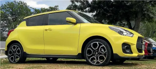  ?? PHOTOS: ROB MAETZIG/ STUFF ?? The new Suzuki Swift Sport - this one resplenden­t in its hero colour Champion Yellow - which is now being launched in New Zealand.