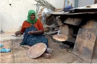  ?? AFP ?? Libyan Salma Khalil bakes bread in Tawergha. —