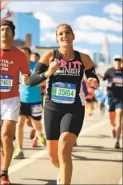  ??  ?? BRITTANY O’Neill not only completed the 2014 New York City Marathon, she did it in under four hours.