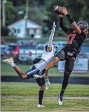  ?? Courtney Couey, Ringgold Tiger Shots ?? LaFayette’s Jaden Morris, seen here trying to catch a pass on the sideline against Ringgold’s Kishaun Taylor, was named the Senior Iron Man for Region 6-3A last week.