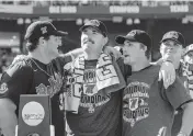  ?? JOHN PETERSON AP ?? From left, Mississipp­i’s Ben Van Cleve, Tim Elko and Justin Bench celebrate after beating Oklahoma in Game 2 of the College World Series on Sunday.