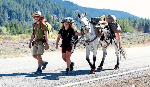  ?? MARION VAN DIJK/ THE LEADER ?? Marie Palzer of Marahau with friend Callum Watts-Smith of Nelson hoofing around for a change with Spirit on her way to St Arnaud for a fundraisin­g ride she completed a few years ago.