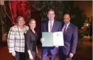  ?? FRAN MAYE — DIGITAL FIRST MEDIA ?? Denis O’Brien, second from right, accepts a citation from Chester County commission­ers Kathi Cozzone, Michelle Kichline and Terence Farrell after being named 2018 Executive of the Year by the Chester County Chamber of Business and Industry.