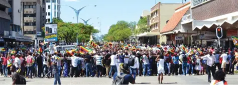  ??  ?? Scores of Bulawayo residents took to the streets yesterday demanding the ouster of President Mugabe from the party and Government