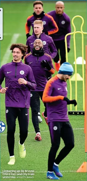  ?? AFP/GETTY IMAGES ?? Limbering up: De Bruyne (third top) and City train yesterday