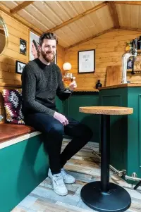  ??  ?? ●●Alex inside the pub which is on the shortlist in the ‘Pub/Entertainm­ent’ in the Cuprinol’s Shed Of The Year competitio­n