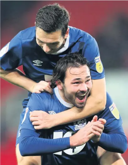  ?? Lewis Storey ?? Bradley Dack (bottom) and Stewart Downing of Blackburn Rovers celebrate their side’s victory against Stoke City in the Sky Bet Championsh­ip